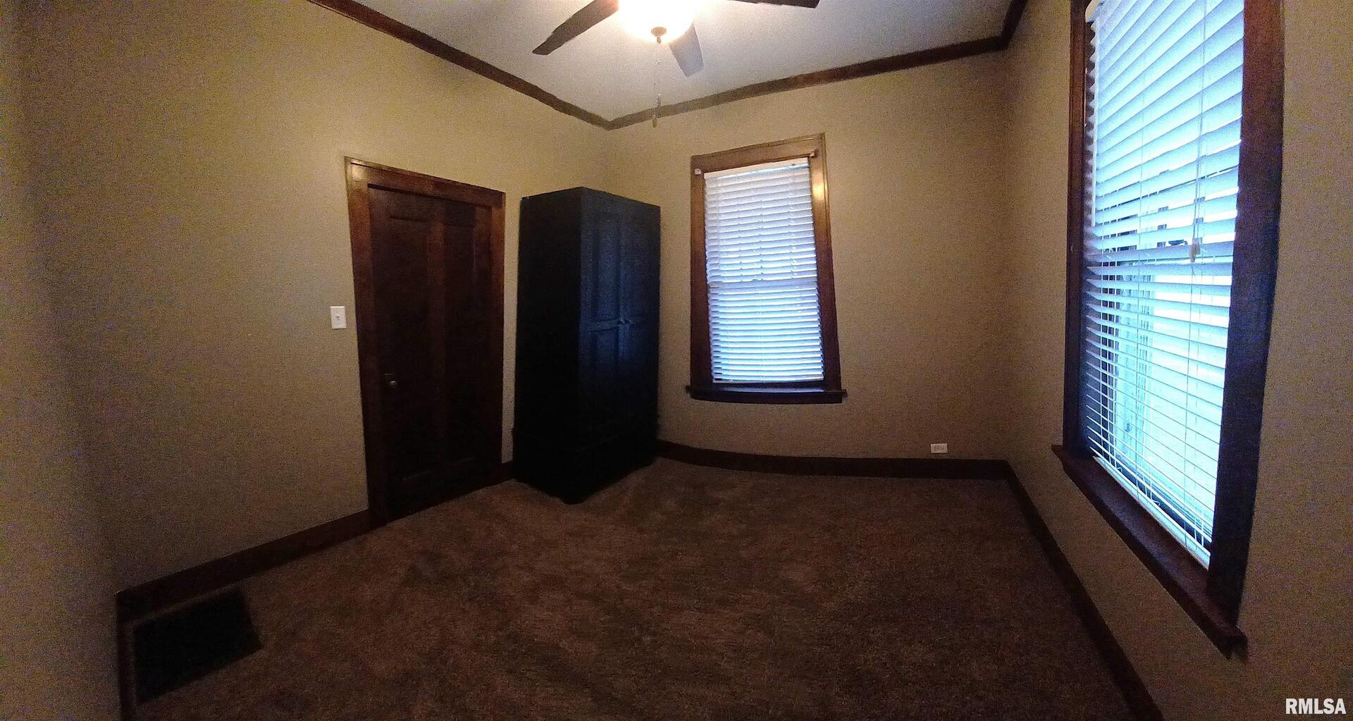 125 A Street Buda, IL 61314 - Photo 29 of 29 an empty room with windows and closet