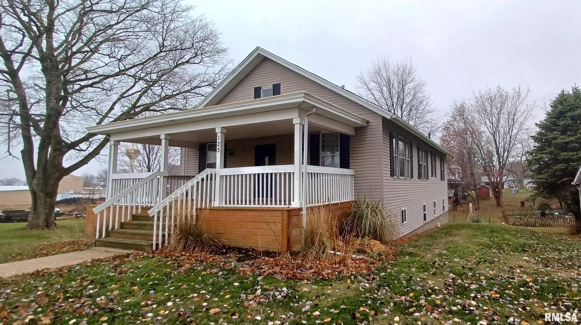 125 A Street Buda, IL 61314 - Photo 5 of 29 a view of a house with a yard