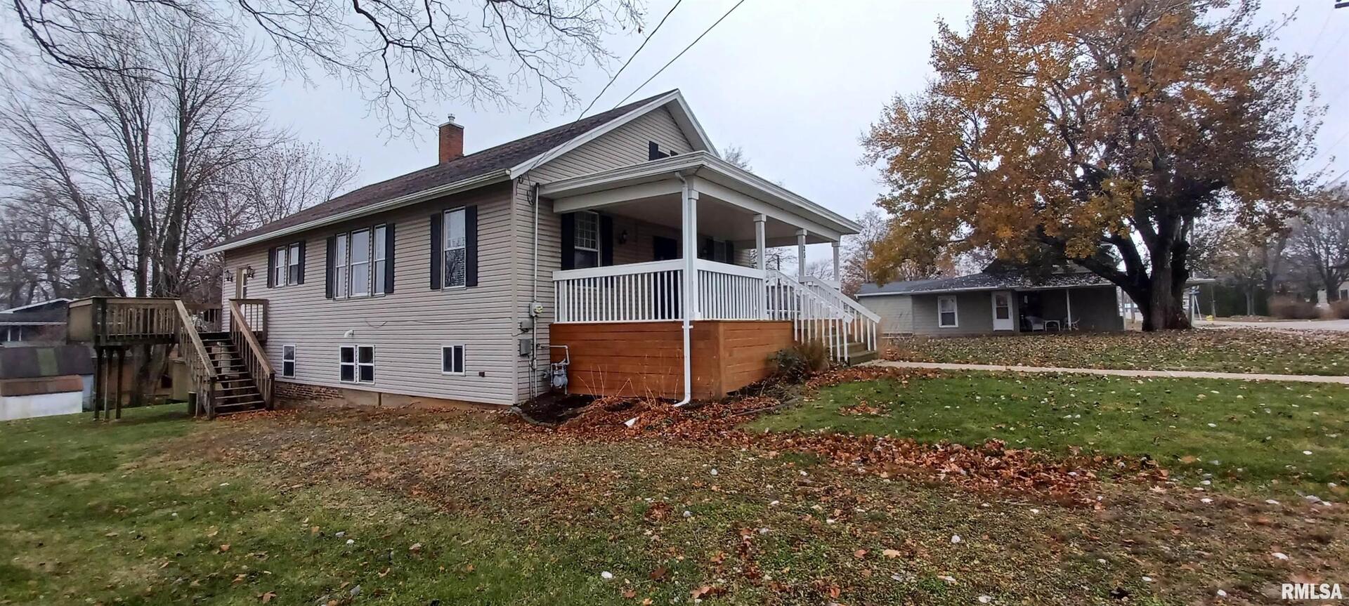125 A Street Buda, IL 61314 - Photo 6 of 29 a front view of a house with a yard