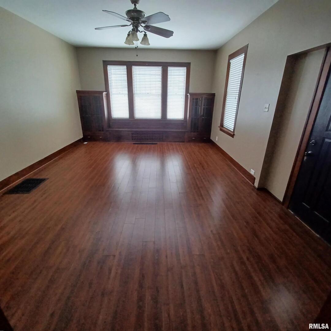 125 A Street Buda, IL 61314 - Photo 8 of 29 wooden floor in an empty room with a window