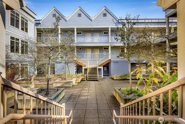 front view of a brick house with a large windows