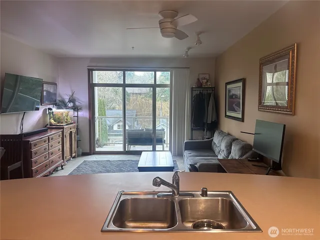 a front view of a residential apartment building with a yard