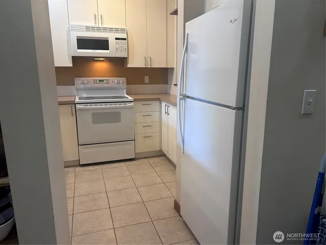 a view of a building with a yard