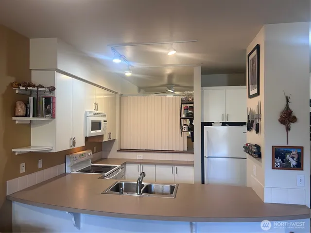 a view of a brick house with a small yard