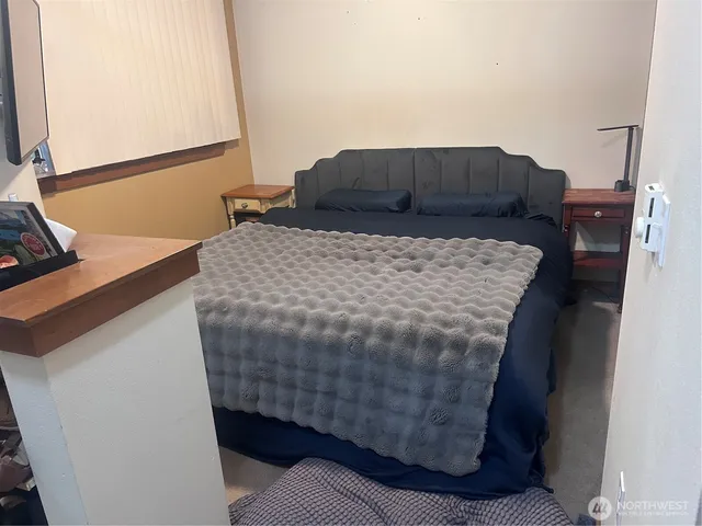 a view of a patio with table and chairs with wooden floor and fence