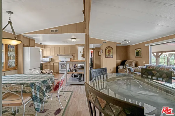 a bedroom with a bed and flat screen tv
