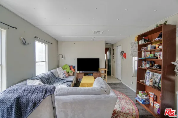 a very nice looking room with a large window and a table