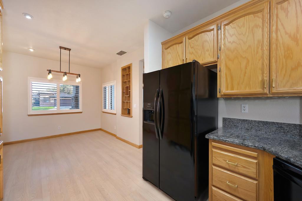 9594 Prost Court Elk Grove, CA 95758 - Photo 17 of 46 a kitchen with stainless steel appliances granite countertop a refrigerator and a stove top oven