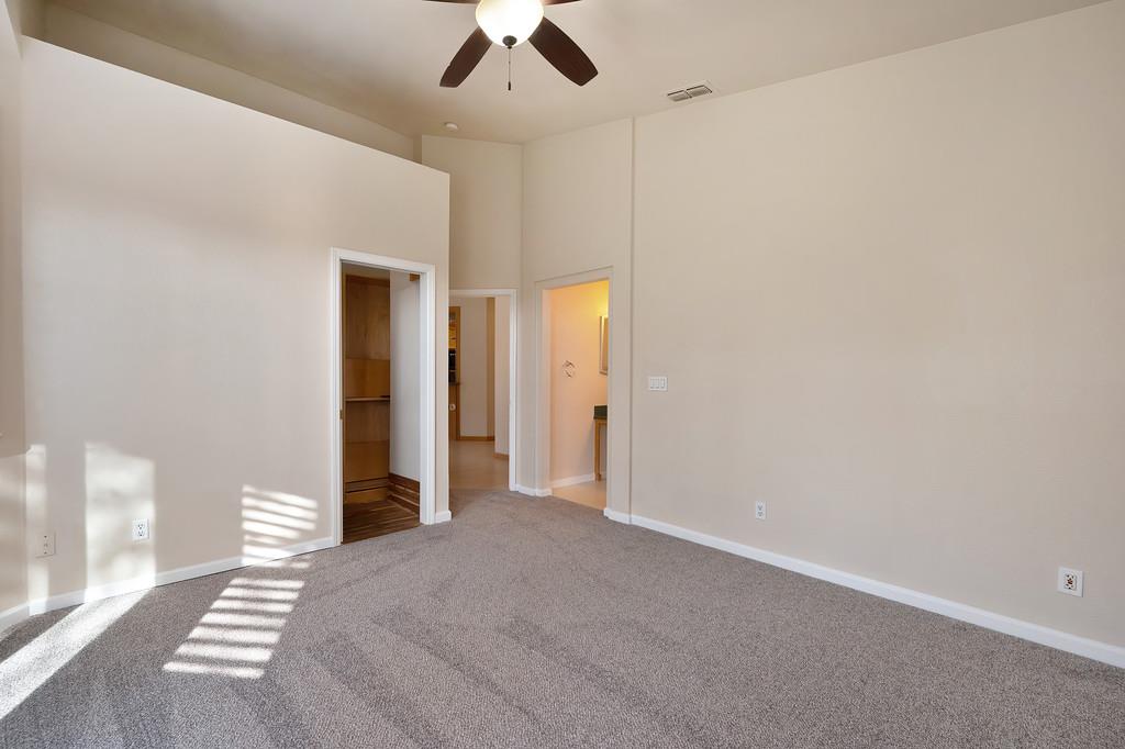 9594 Prost Court Elk Grove, CA 95758 - Photo 28 of 46 a view of a livingroom with a ceiling fan and window