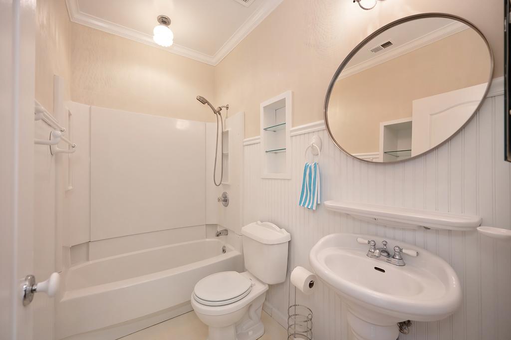 9594 Prost Court Elk Grove, CA 95758 - Photo 32 of 46 a bathroom with a sink a toilet and a mirror