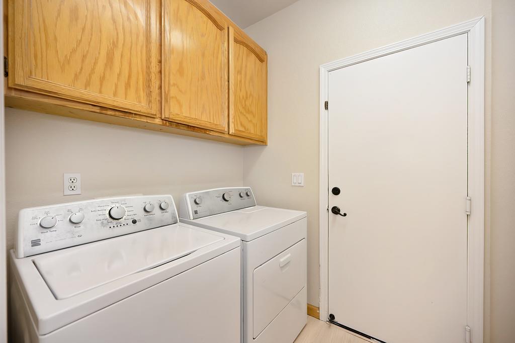 9594 Prost Court Elk Grove, CA 95758 - Photo 35 of 46 a utility room with dryer and washer