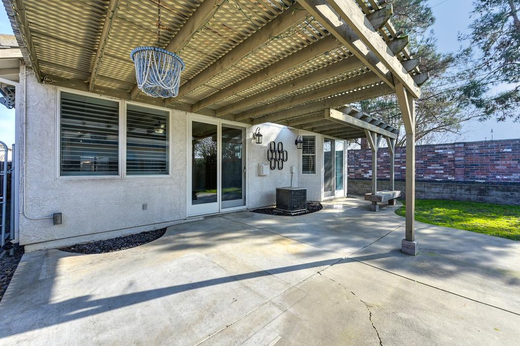 9594 Prost Court Elk Grove, CA 95758 - Photo 41 of 46 a view of a house with backyard porch and sitting area