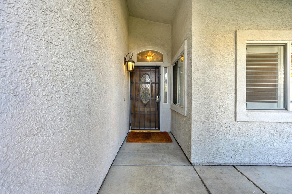 9594 Prost Court Elk Grove, CA 95758 - Photo 6 of 46 a view of a hallway with wooden floor