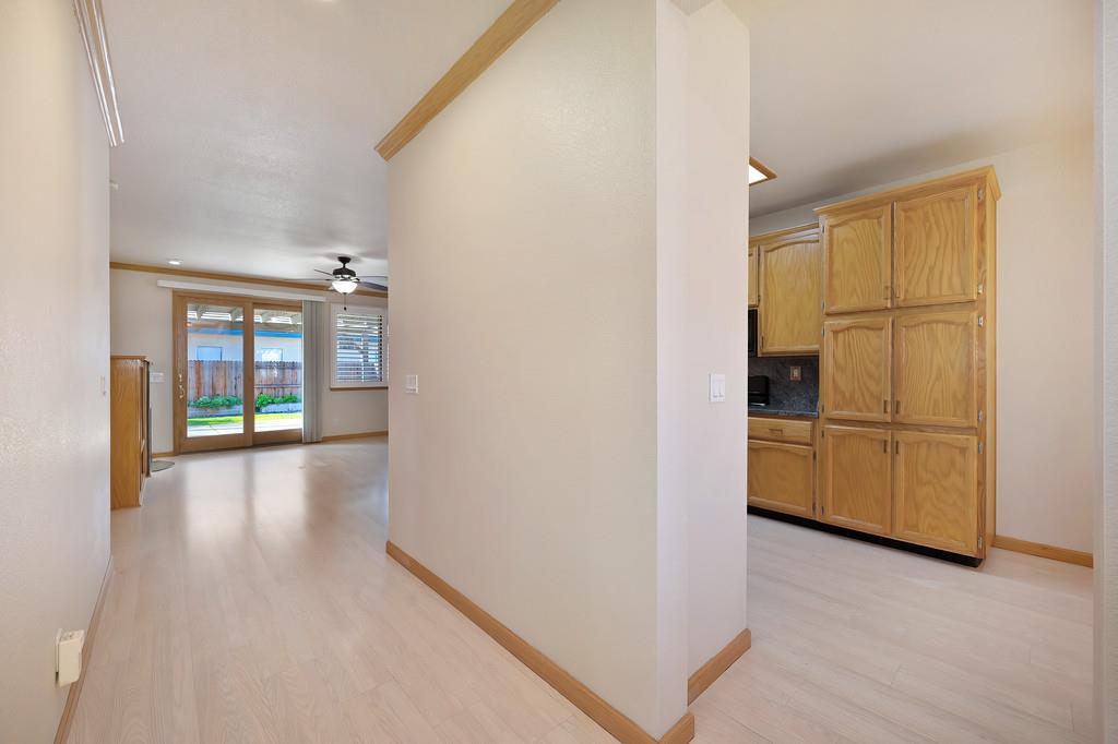 9594 Prost Court Elk Grove, CA 95758 - Photo 9 of 46 a view of empty room with wooden floor