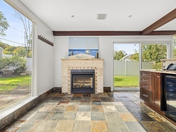 50 First Parish Road Scituate, MA 02066 - Photo 11 of 42 a living room with a fireplace and a open kitchen view