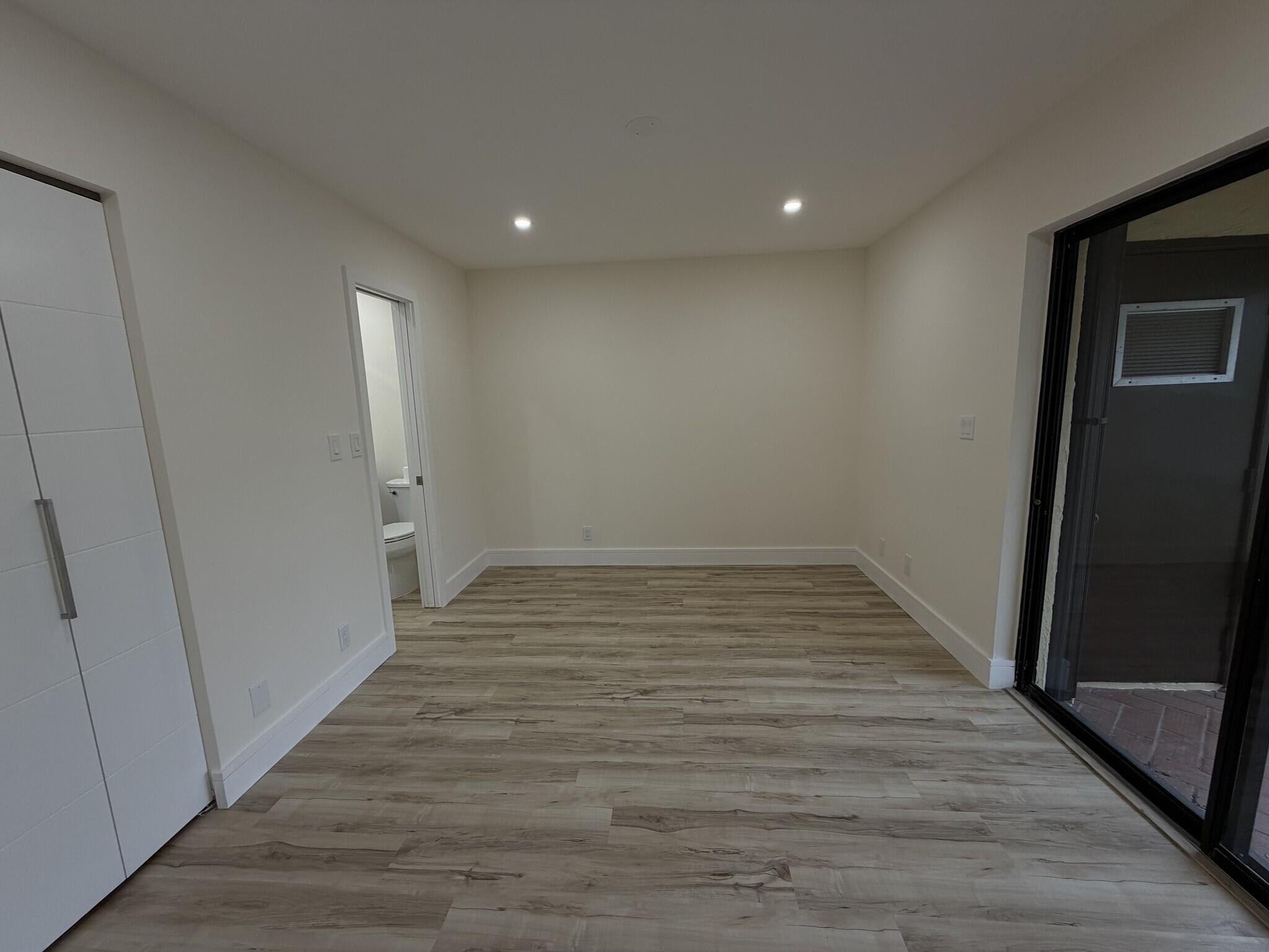 705 Banks Road Margate, FL 33063 - Photo 20 of 44 a view of a hallway with wooden floor