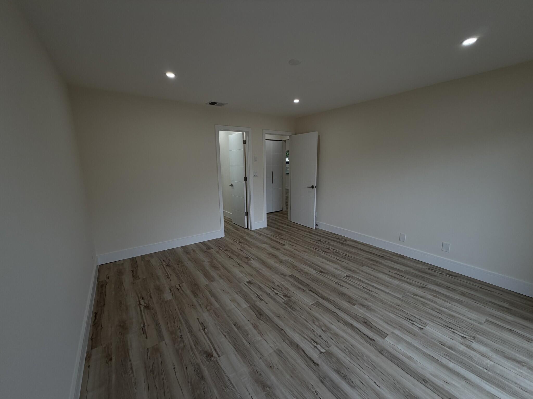705 Banks Road Margate, FL 33063 - Photo 25 of 44 a view of room with wooden floor and window