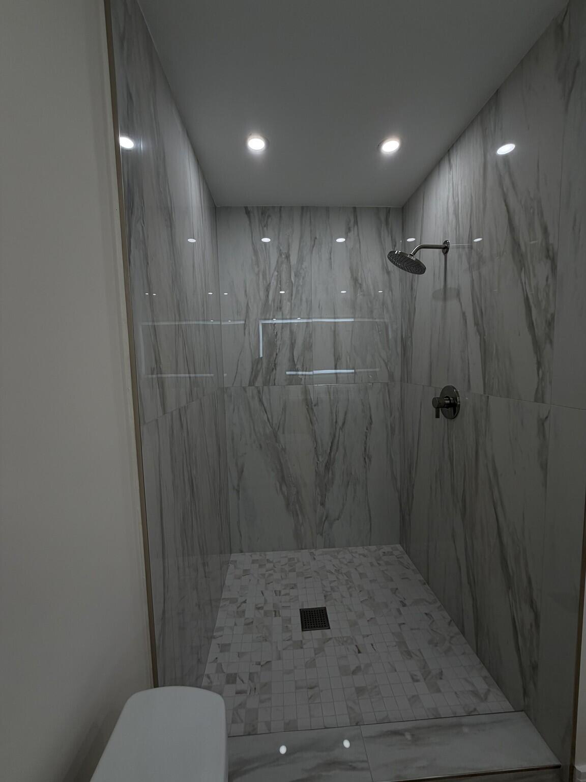 705 Banks Road Margate, FL 33063 - Photo 27 of 44 a bathroom with a shower toilet and sink