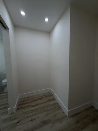 a view of room with wooden floor