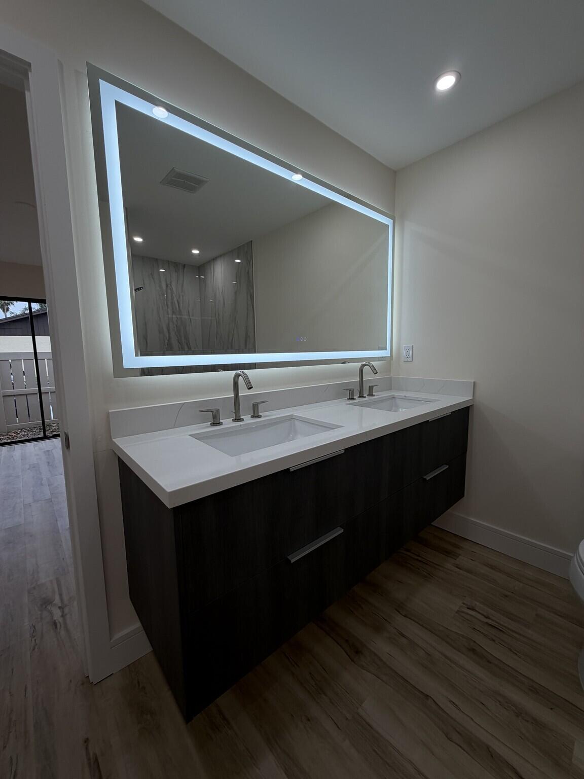 705 Banks Road Margate, FL 33063 - Photo 31 of 44 a bathroom with a sink double vanity and a mirror