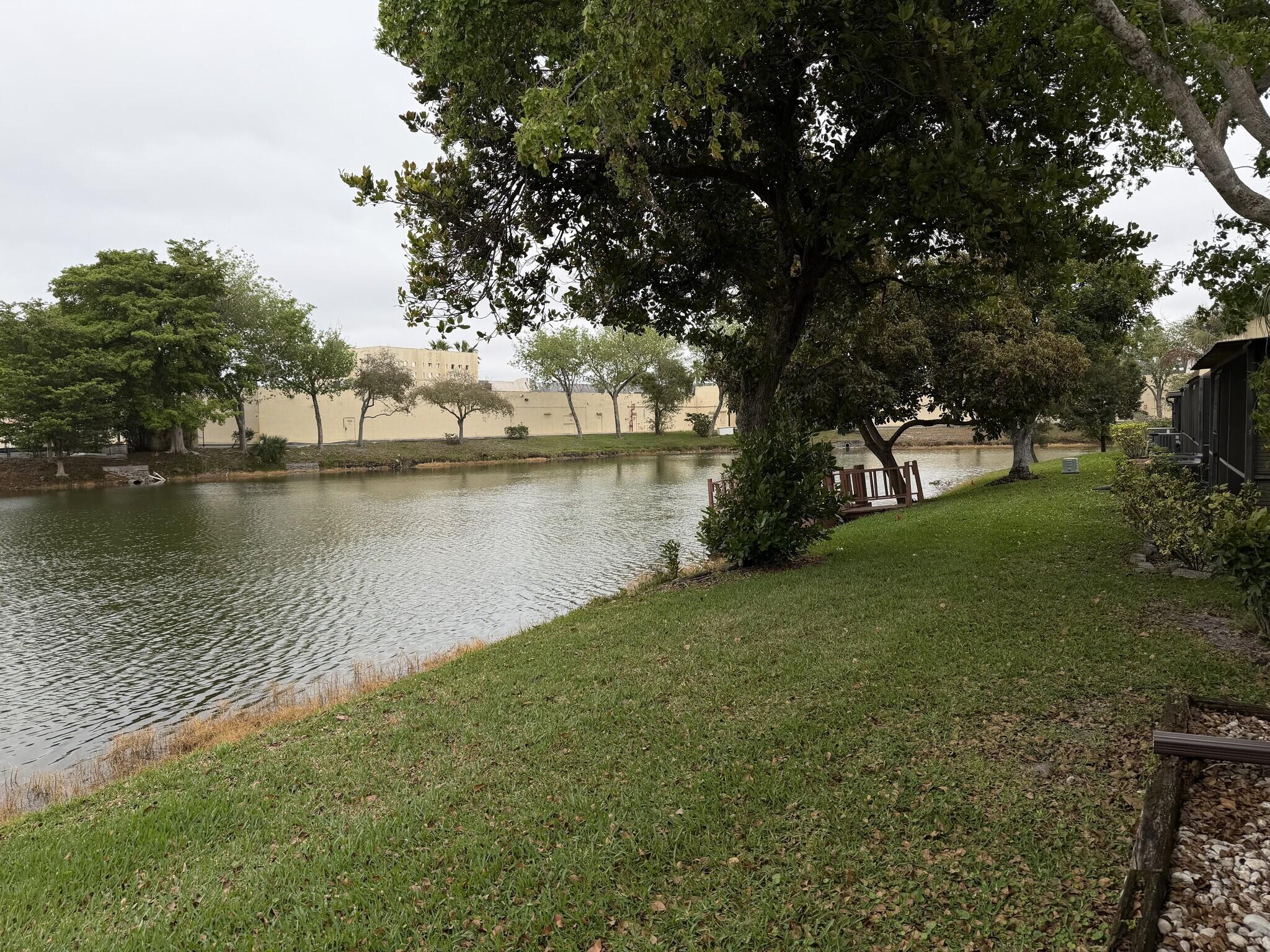 705 Banks Road Margate, FL 33063 - Photo 35 of 44 a view of a lake with houses in outdoor space