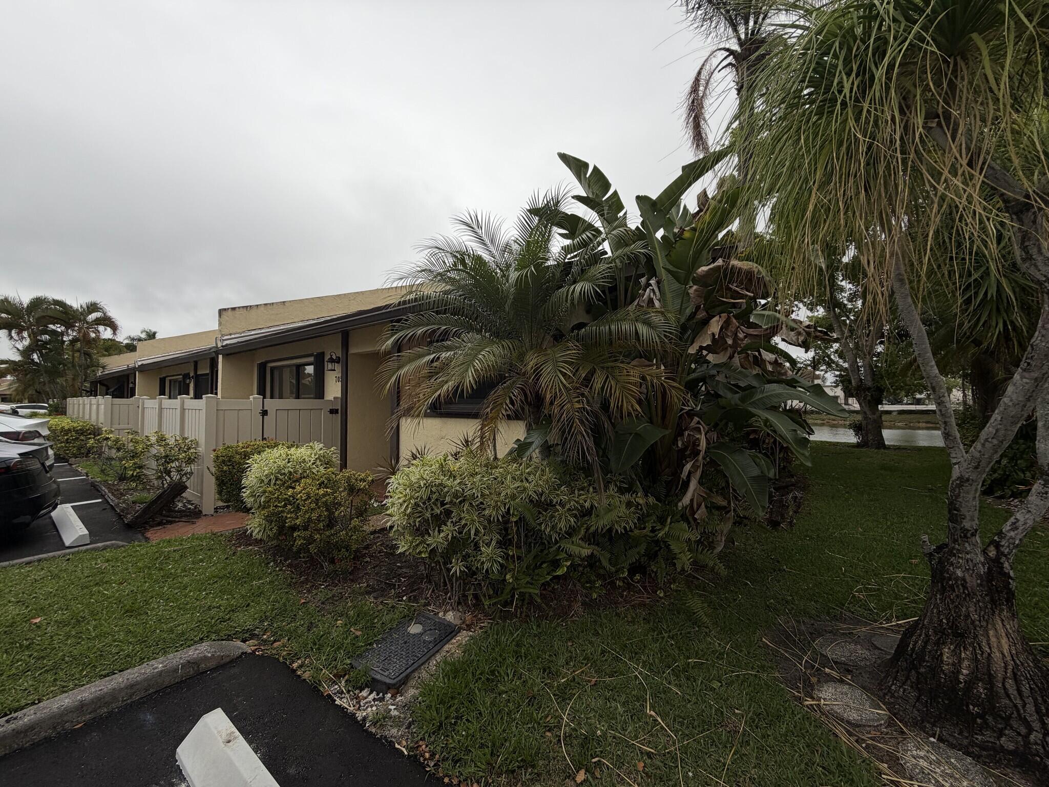 705 Banks Road Margate, FL 33063 - Photo 43 of 44 a front view of a house with garden