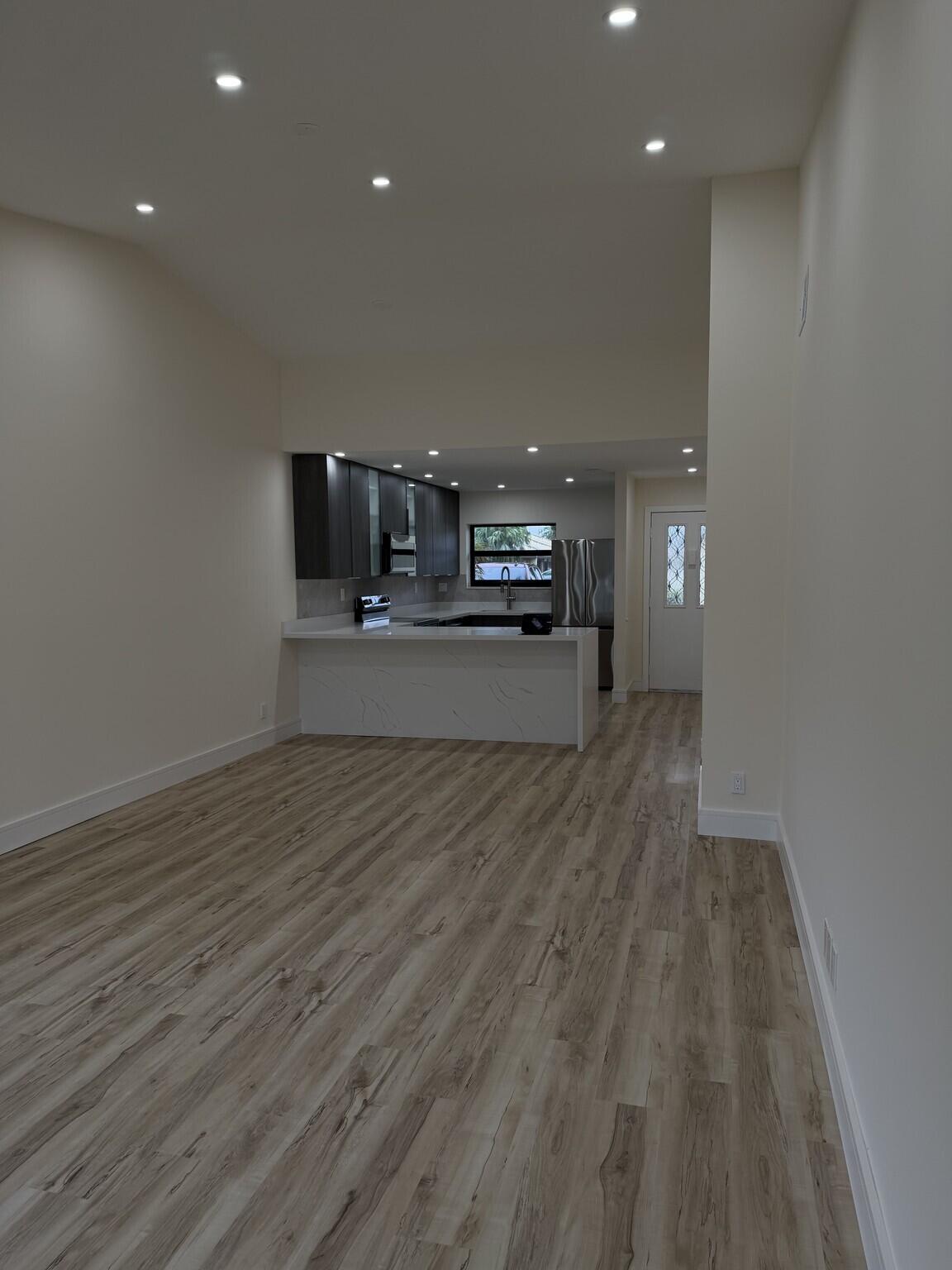 705 Banks Road Margate, FL 33063 - Photo 8 of 44 a view of a kitchen with a sink and a window