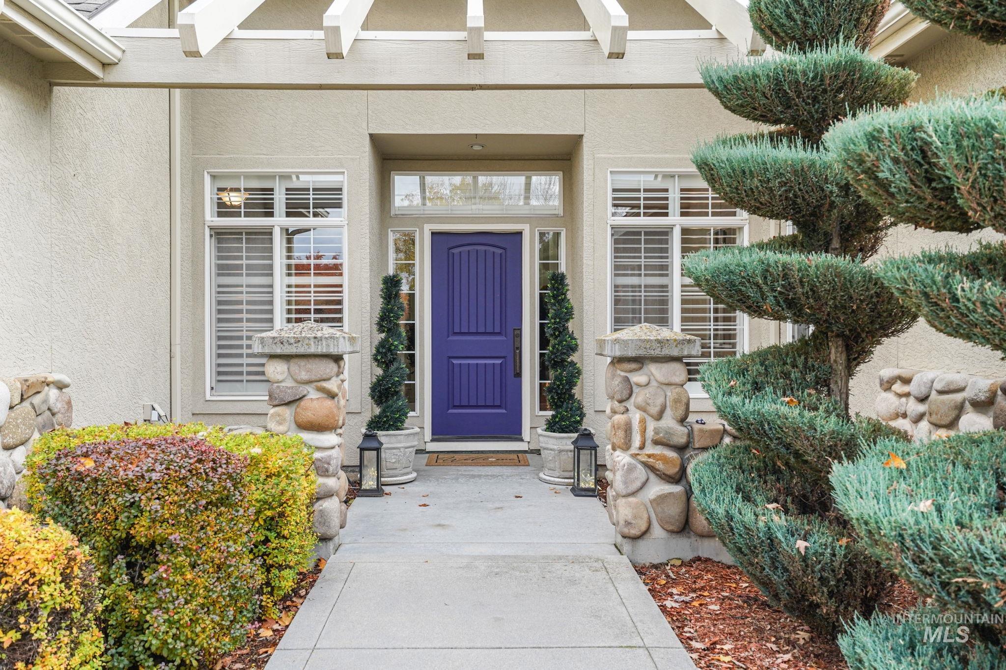 5790 North Wellspring Way Boise, ID 83713 - Photo 2 of 41 View of exterior entry with stucco siding