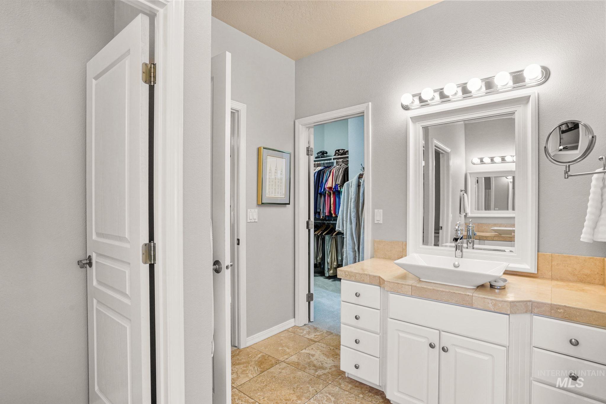 5790 North Wellspring Way Boise, ID 83713 - Photo 21 of 41 Full bathroom with vanity and a spacious closet
