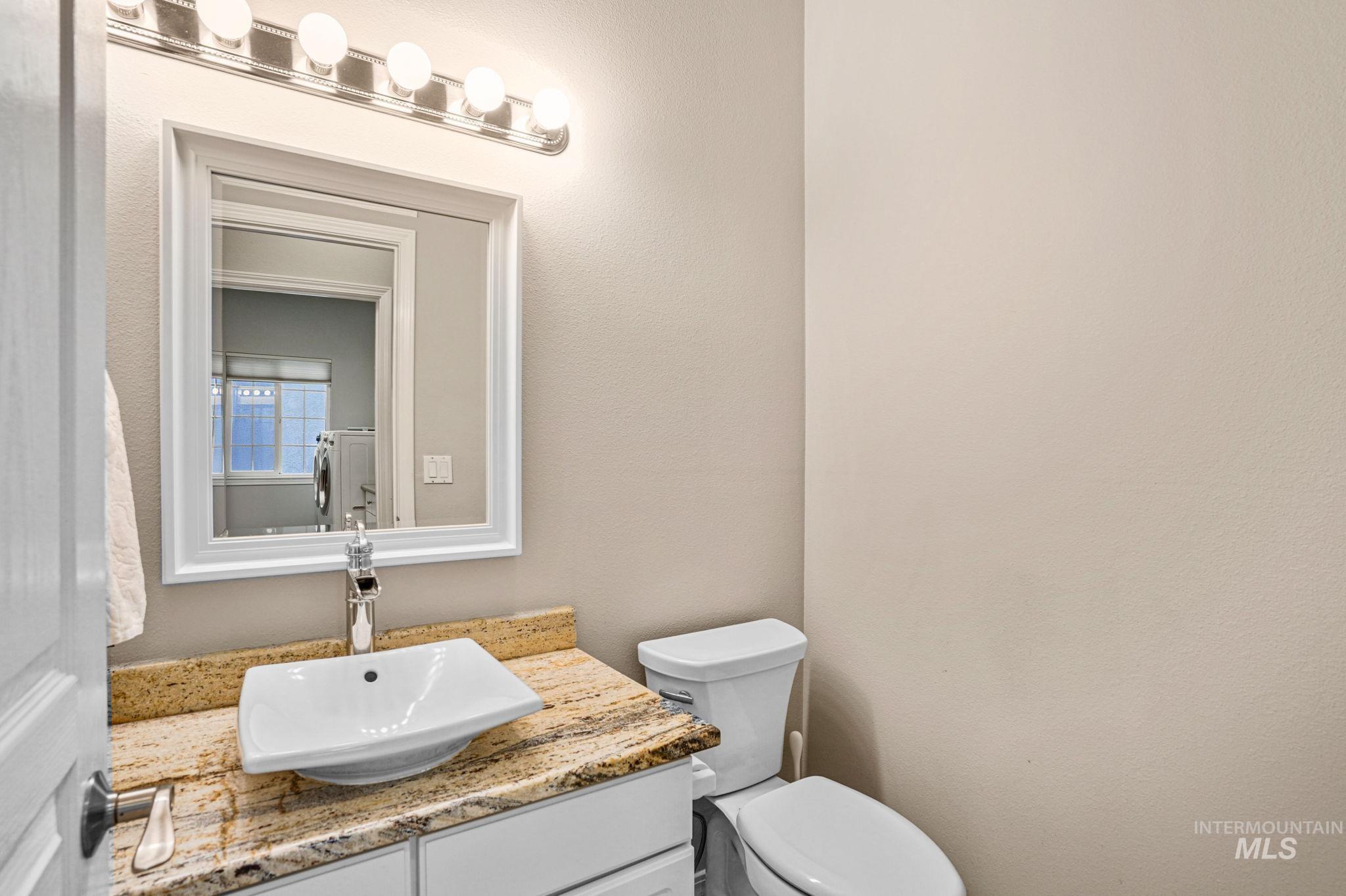 5790 North Wellspring Way Boise, ID 83713 - Photo 34 of 41 Bathroom featuring vanity and toilet