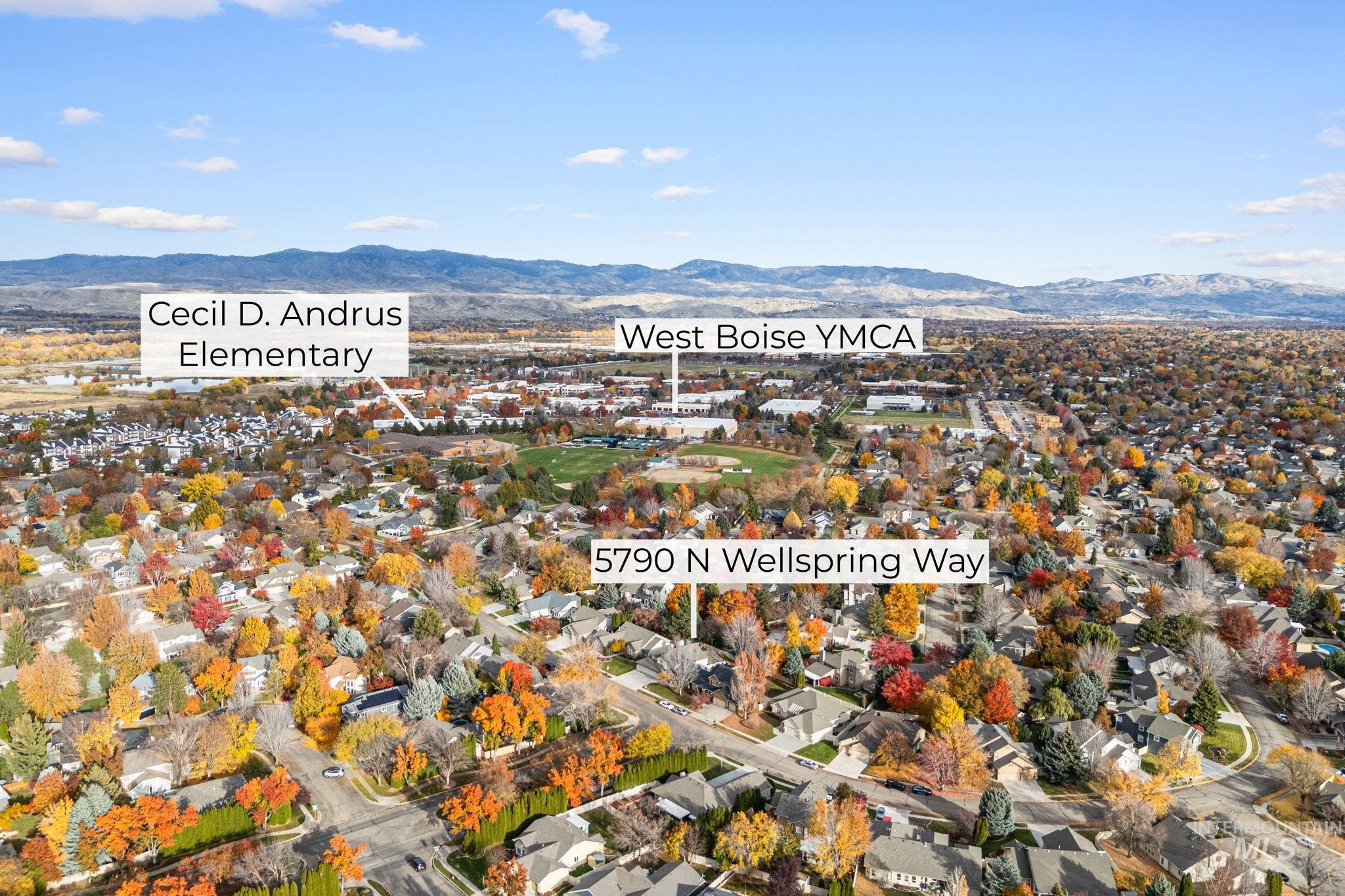 5790 North Wellspring Way Boise, ID 83713 - Photo 7 of 41 Aerial view of property and surrounding area featuring a mountainous background and nearby suburban area