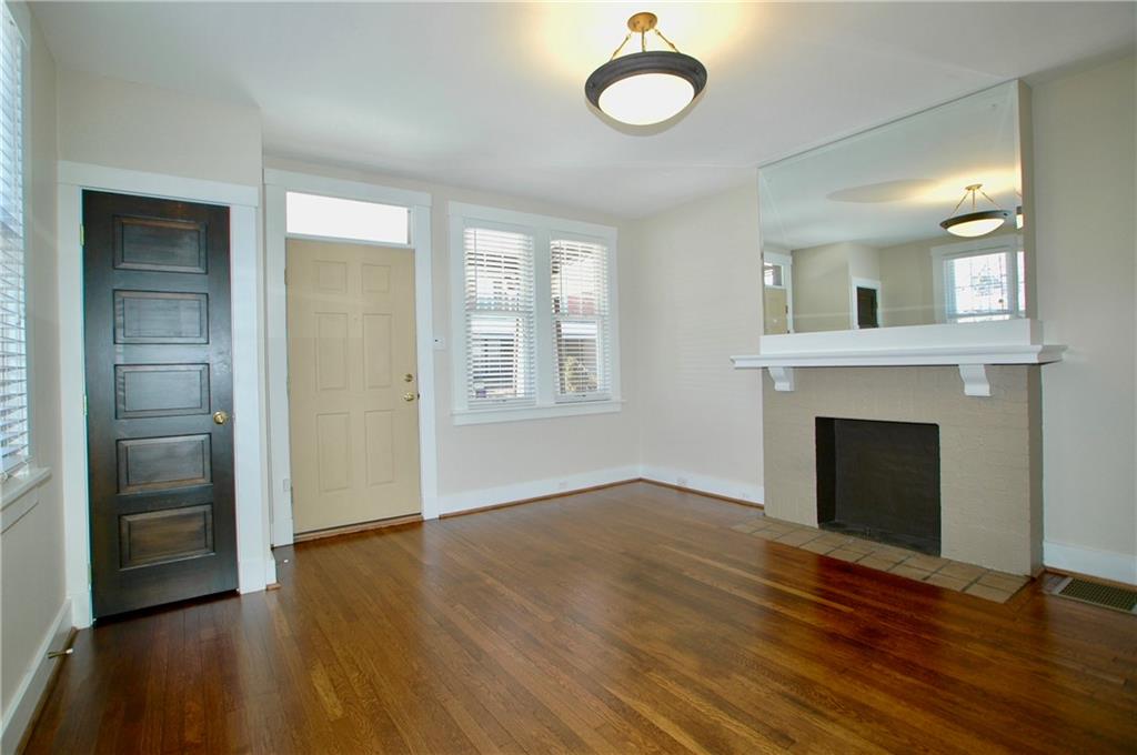 2 Dawson Court Pittsburgh, PA 15213 - Photo 14 of 34 Living room entrance, coat closet, fireplace, with mantle deep enough for TV