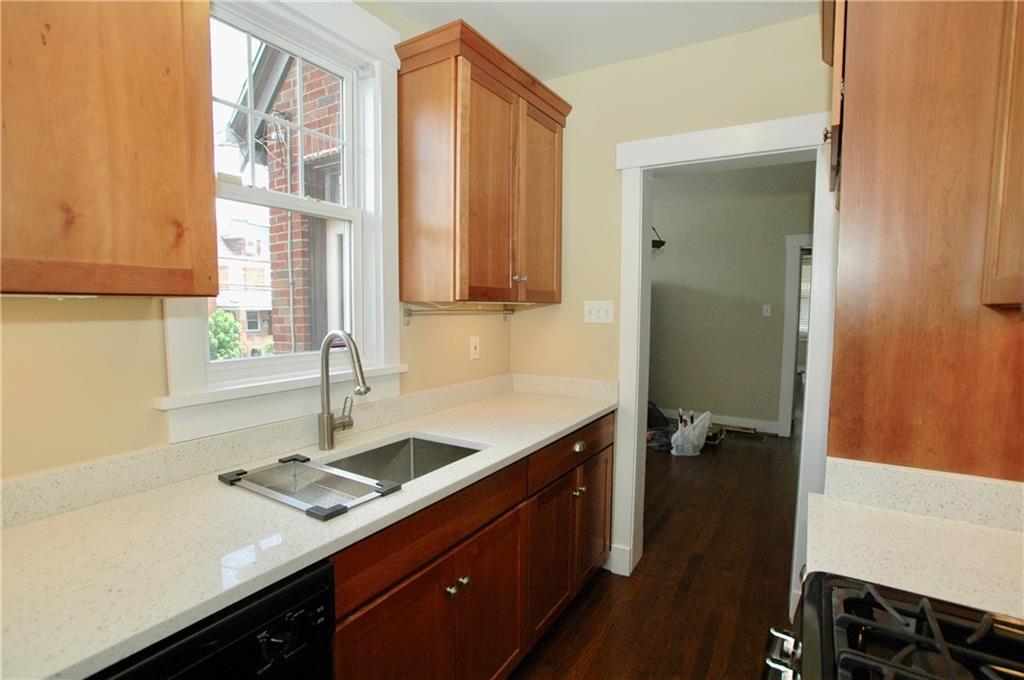 2 Dawson Court Pittsburgh, PA 15213 - Photo 9 of 34 04. Quartz counters and under-mount sink; view toward dining room