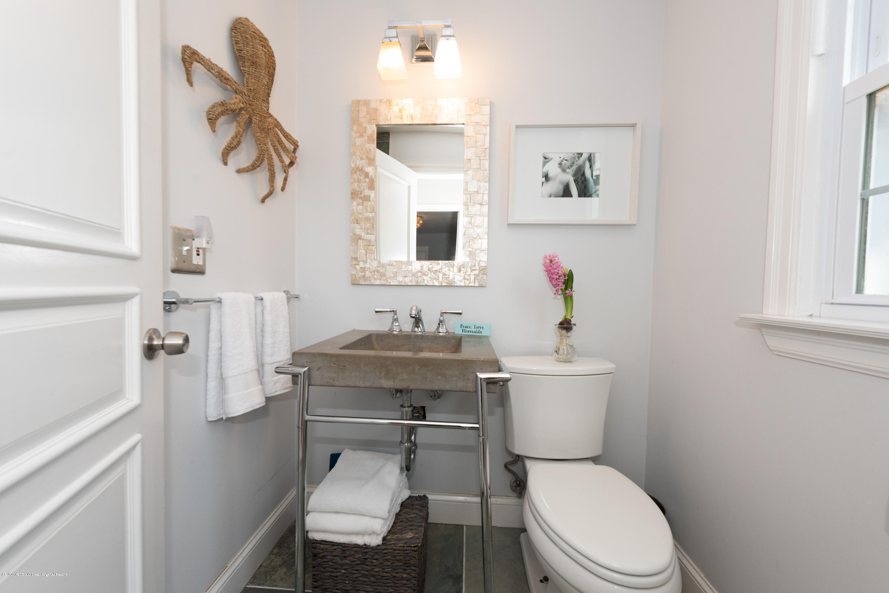 100 Rivers Edge Drive Little Silver, NJ 07739 - Photo 14 of 21 a white toilet sitting next to a bathroom sink