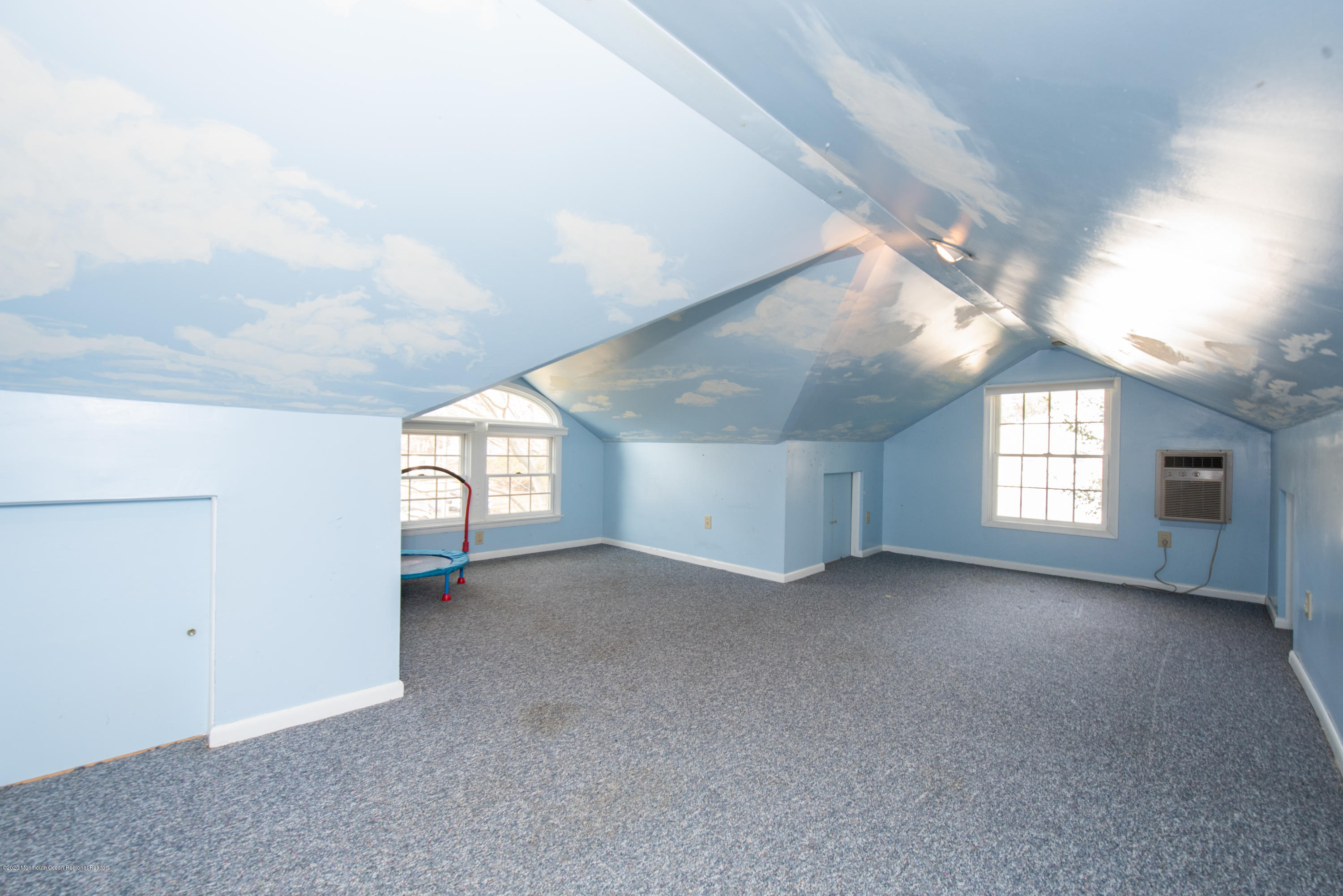 100 Rivers Edge Drive Little Silver, NJ 07739 - Photo 19 of 21 en empty room with windows and ceiling fan