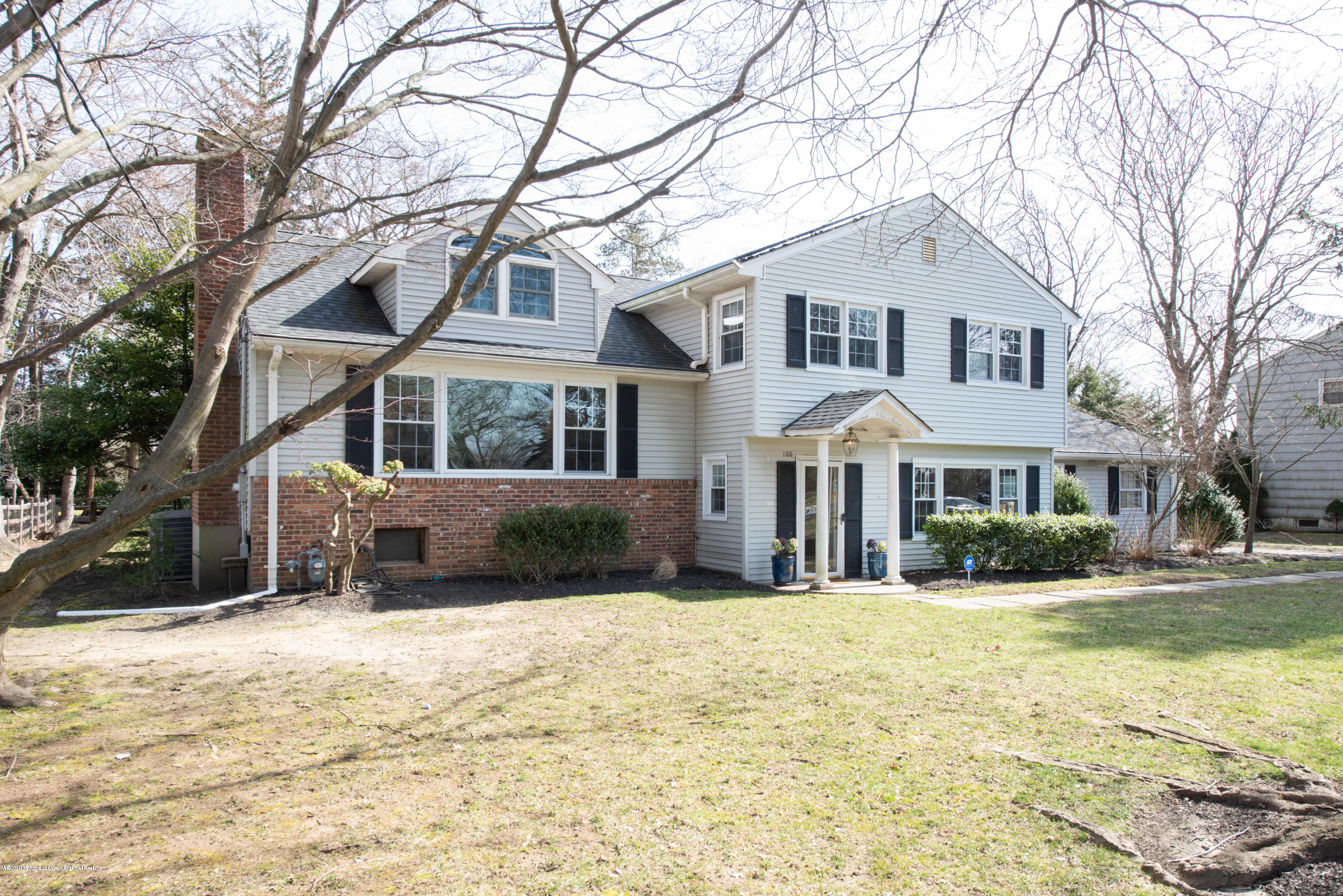 100 Rivers Edge Drive Little Silver, NJ 07739 - Photo 2 of 21 a front view of a house with a yard covered in snow