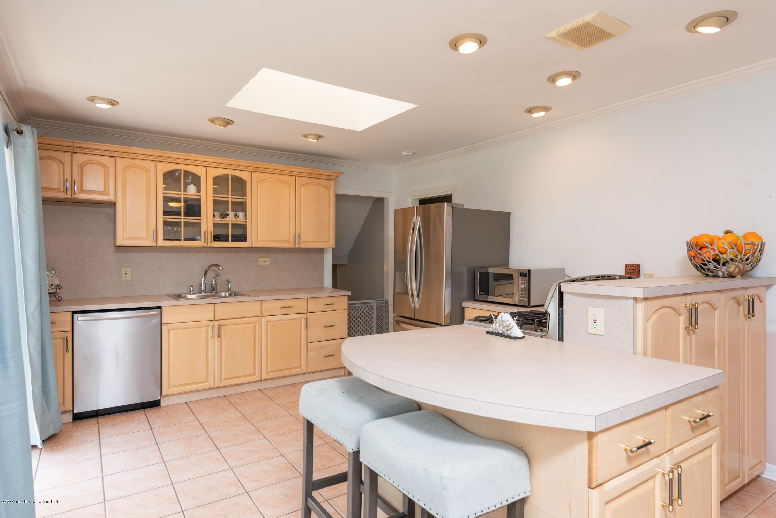 100 Rivers Edge Drive Little Silver, NJ 07739 - Photo 8 of 21 a kitchen with a sink a stove a refrigerator and white cabinets