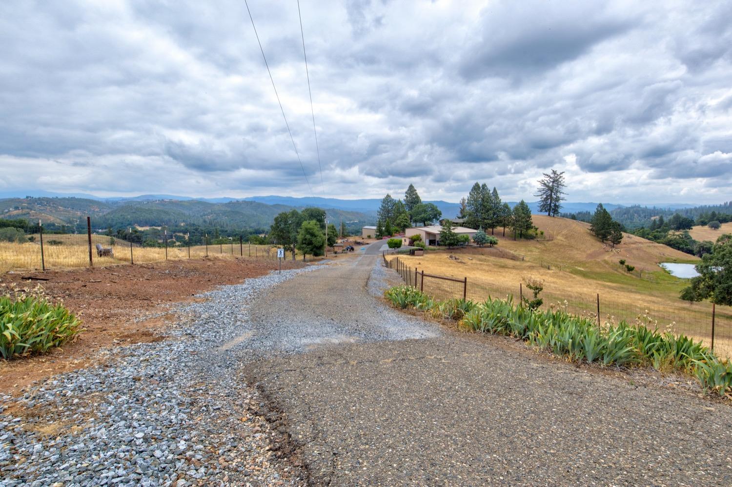 7279 Mountain Ranch Road Mountain Ranch, CA 95246 - Photo 14 of 69 a view of a yard with wooden fence