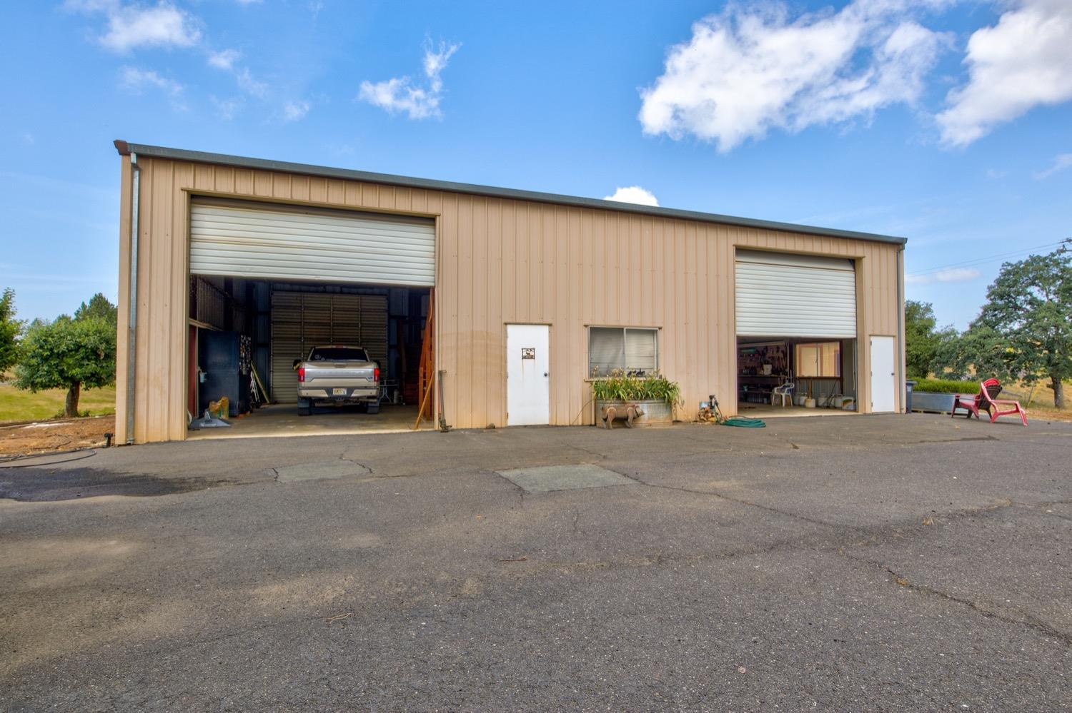 7279 Mountain Ranch Road Mountain Ranch, CA 95246 - Photo 19 of 69 a view of an empty room with a fireplace and a fan