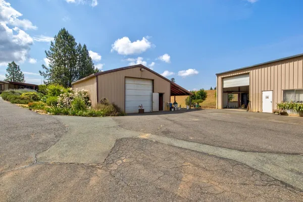 a front view of a house with a yard and a garage