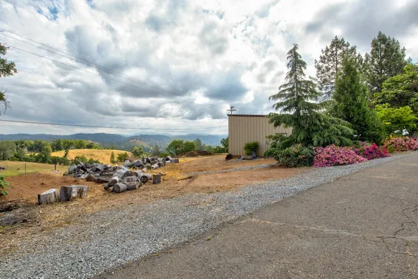 a view of a backyard of a house