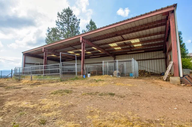 a view of a yard with an outdoor space