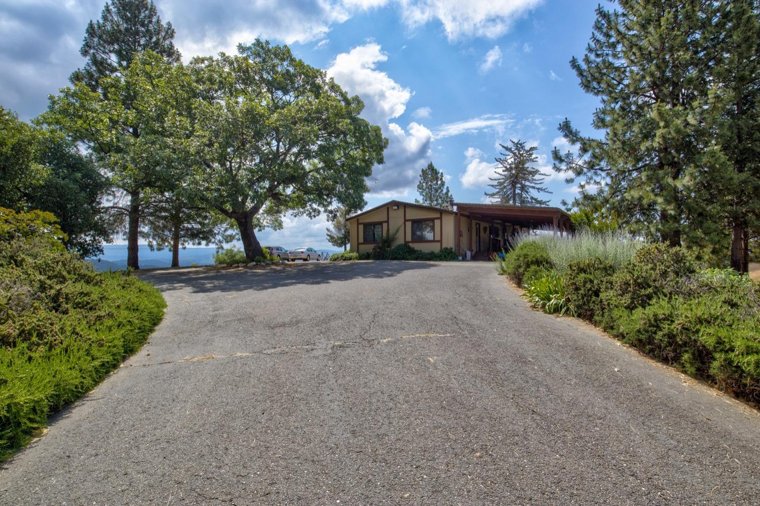 7279 Mountain Ranch Road Mountain Ranch, CA 95246 - Photo 34 of 69 a view of a house with a yard