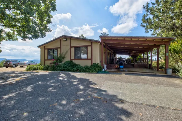 a view of a swimming pool with a yard