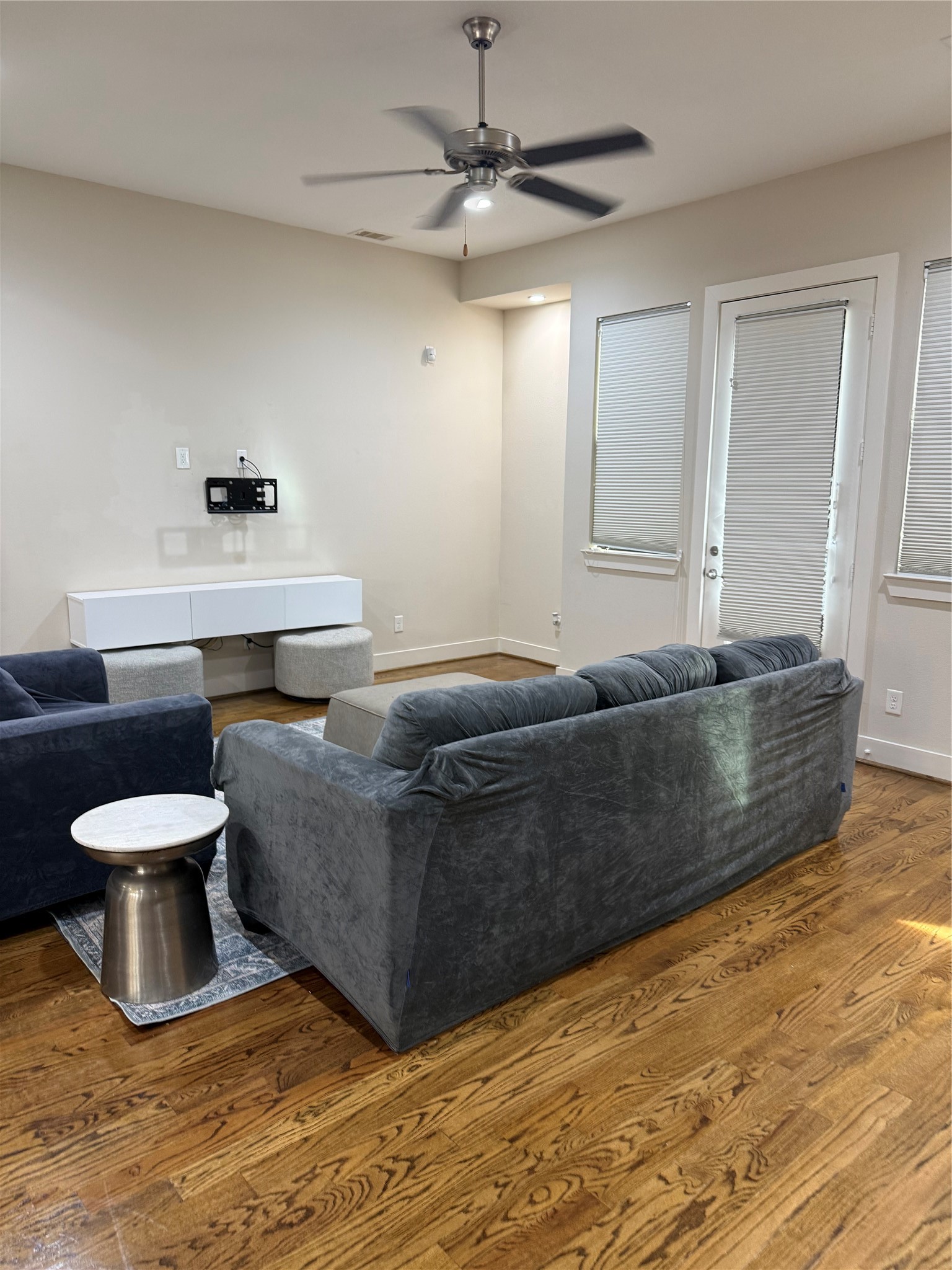 1007 Roberts Street Houston, TX 77003 - Photo 8 of 11 a living room with a couch and a chandelier