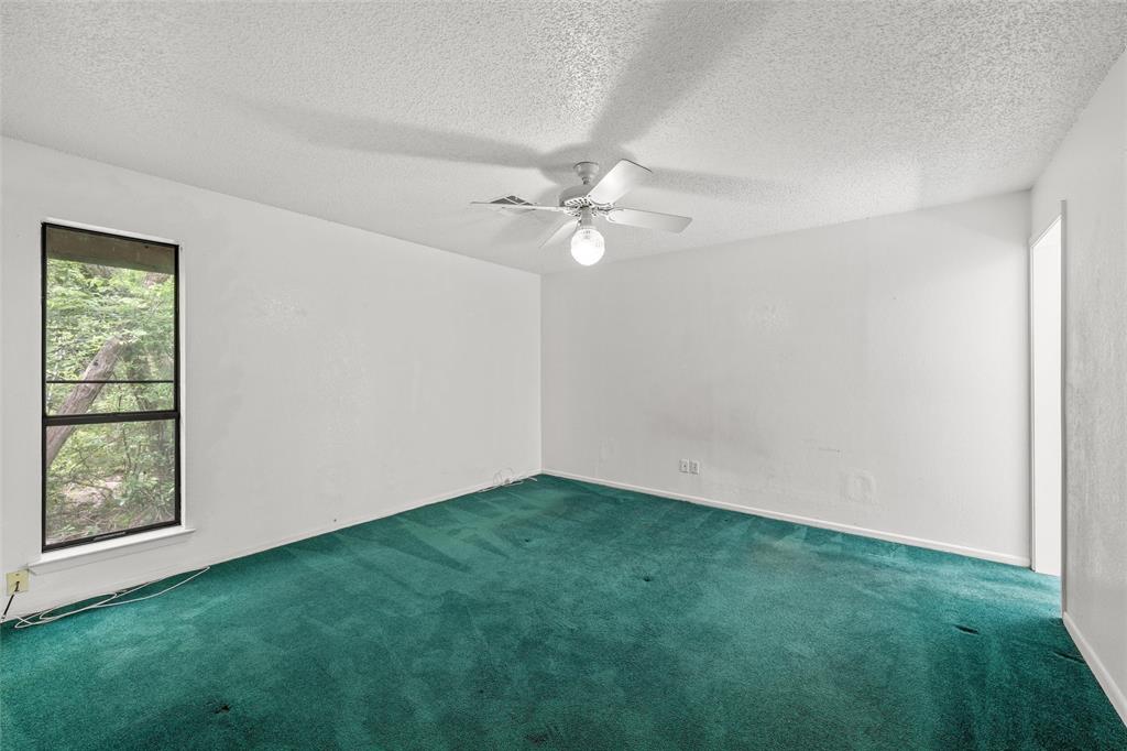 7821 Tallahassee Road Woodway, TX 76712 - Photo 11 of 31 an empty room with fan and window