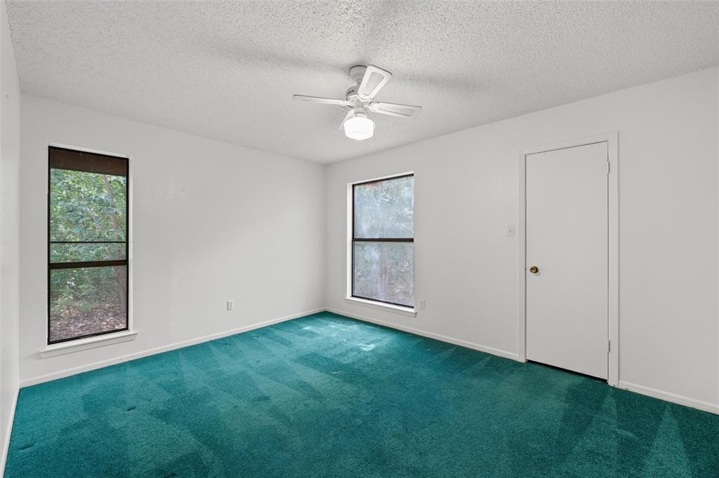 7821 Tallahassee Road Woodway, TX 76712 - Photo 19 of 31 a view of an empty room with a window