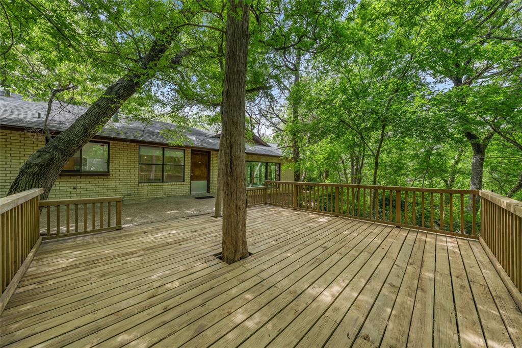 7821 Tallahassee Road Woodway, TX 76712 - Photo 24 of 31 a view of house with deck outdoor seating and trees