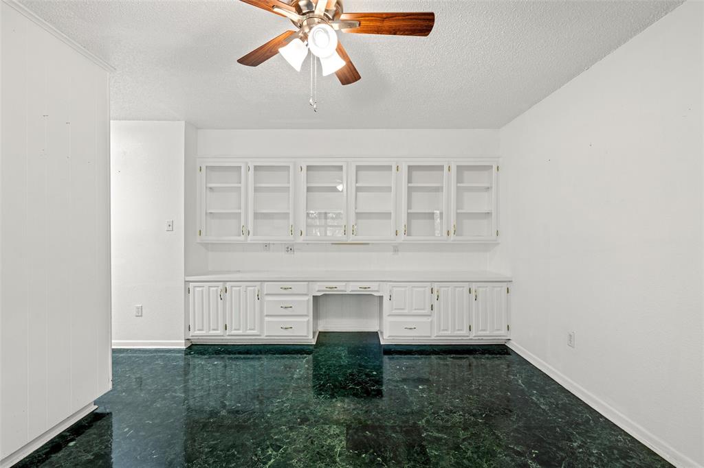 7821 Tallahassee Road Woodway, TX 76712 - Photo 10 of 31 an empty room with cabinet