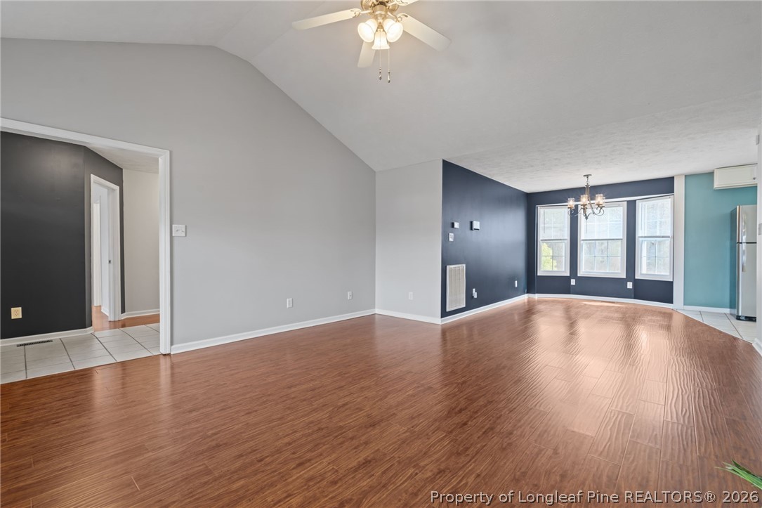 115 Shelby Street Spring Lake, NC 28390 - Photo 11 of 40 a view of an empty room with window and wooden floor